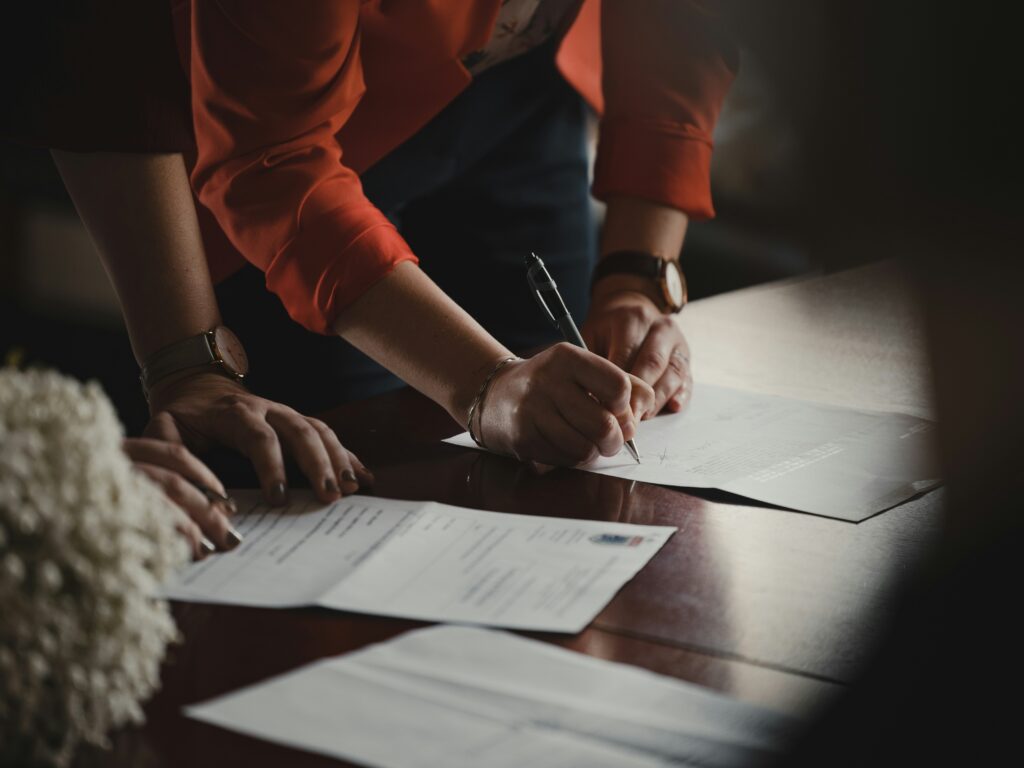 car dealership signing paperwork
